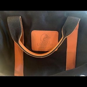 Ducks Unlimited NEW black canvas and leather duffel bag.